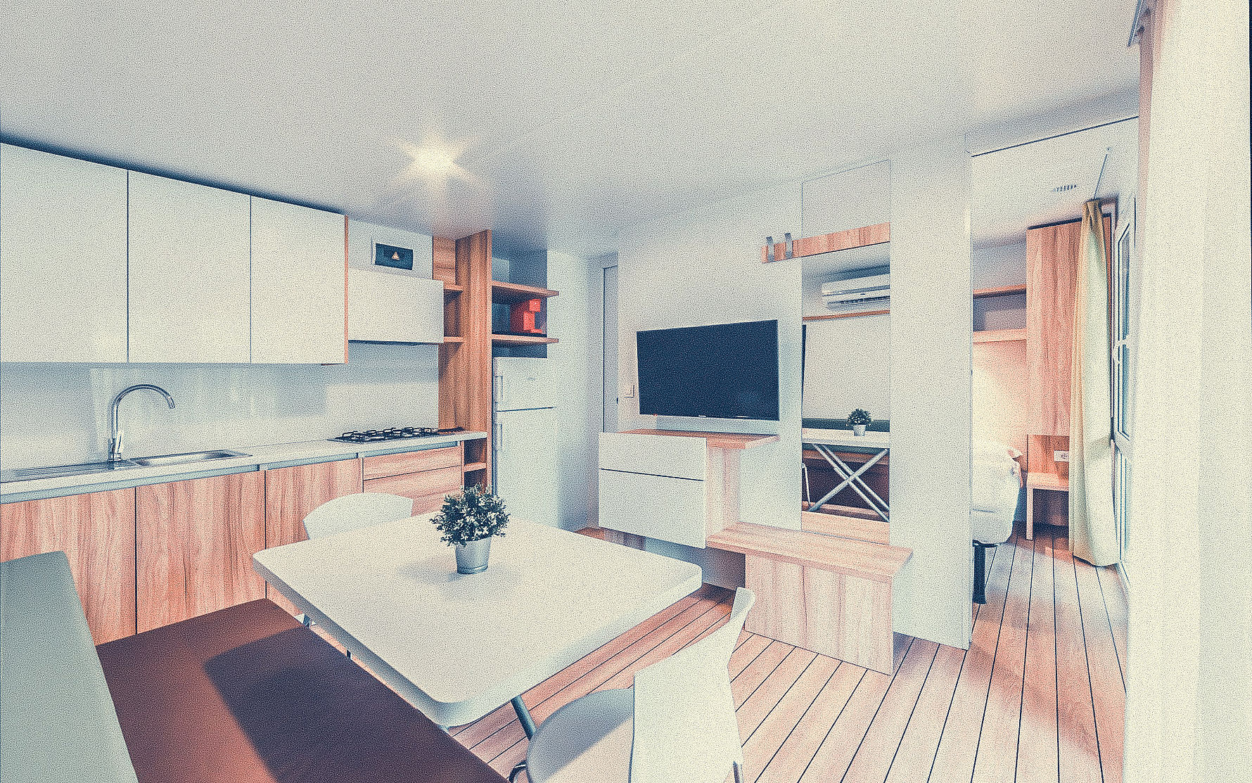 Kitchenette with dining table and television