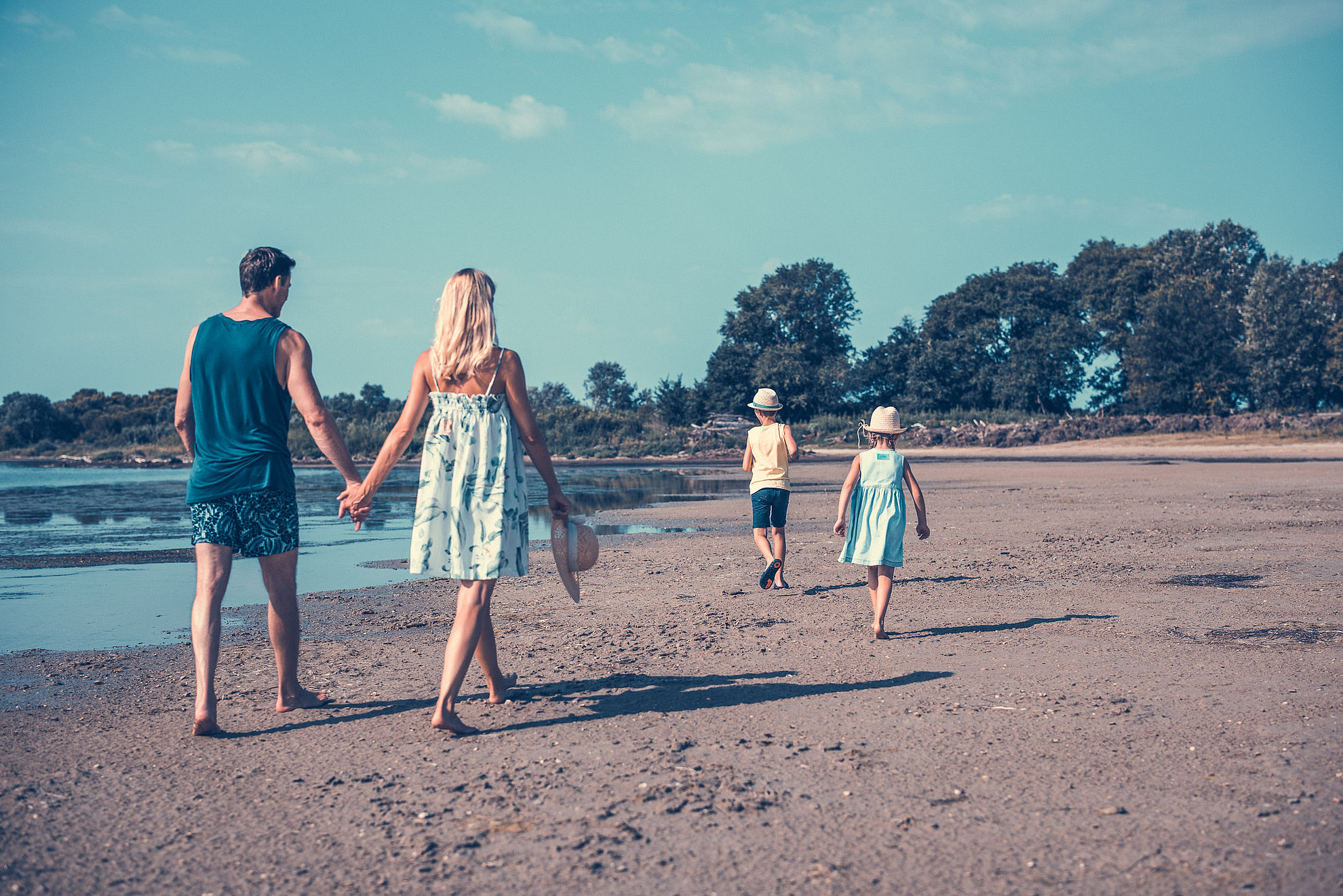 Walk on the beach with the family at low tide