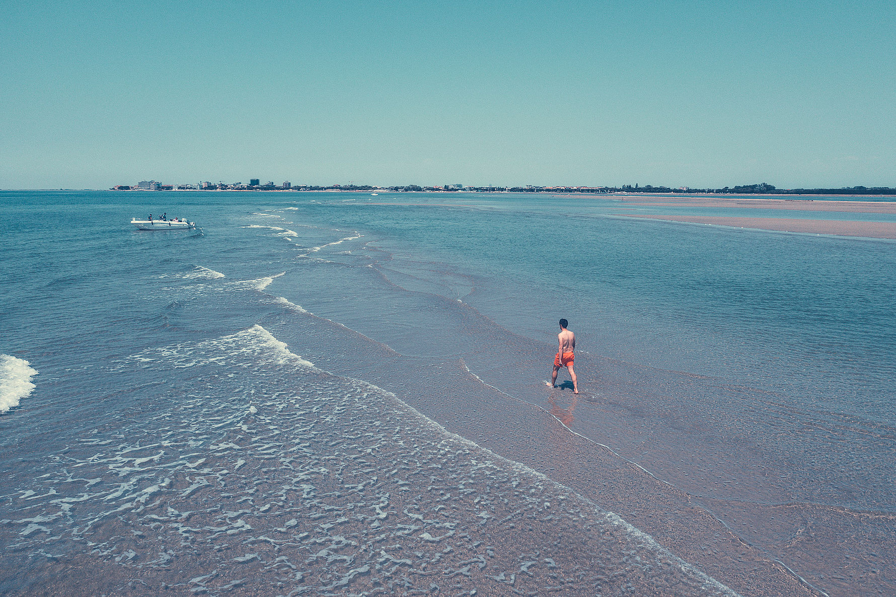Child walking in shallow water